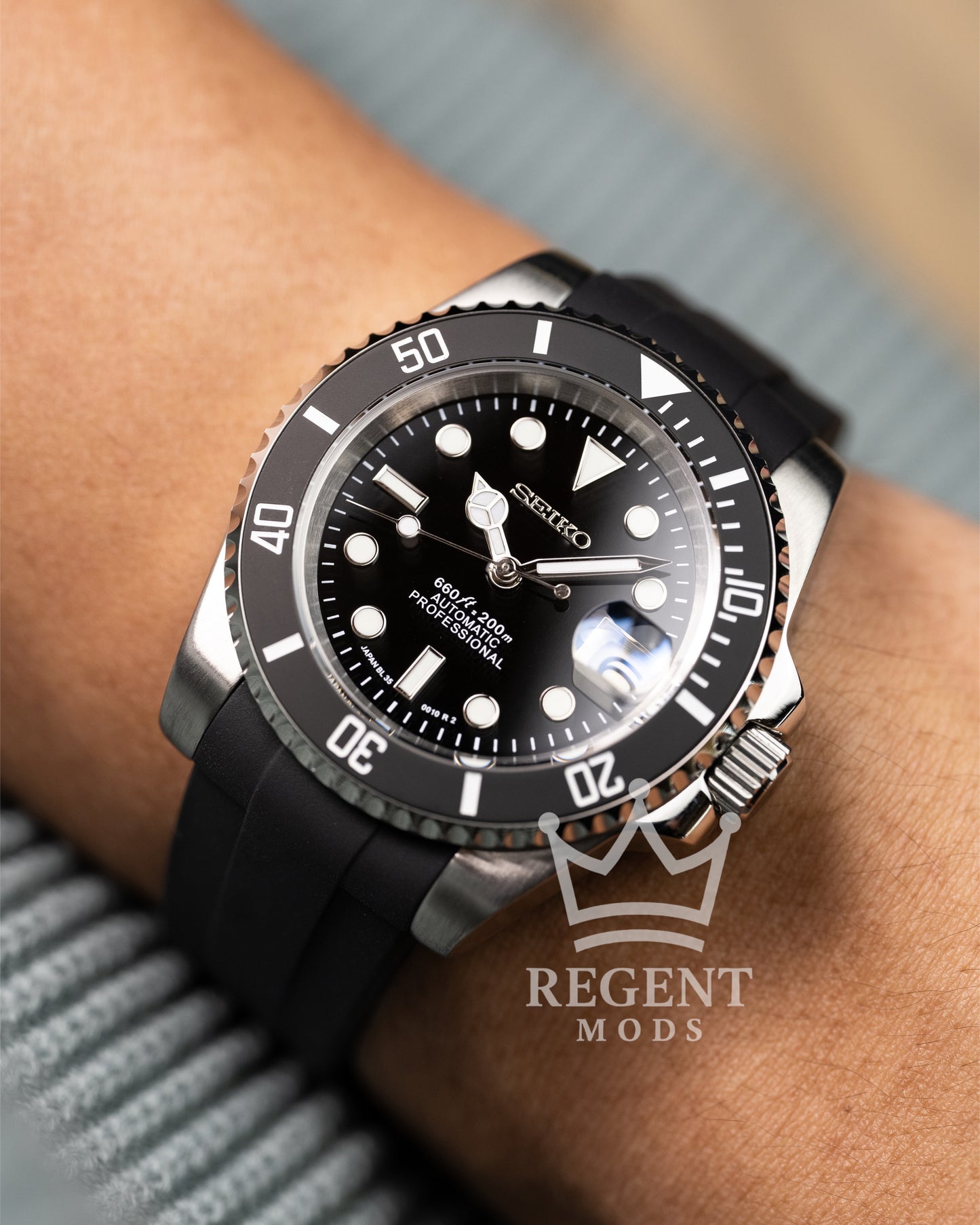 Black Seiko Mod Submariner Worn On Wrist With Rubber Strap