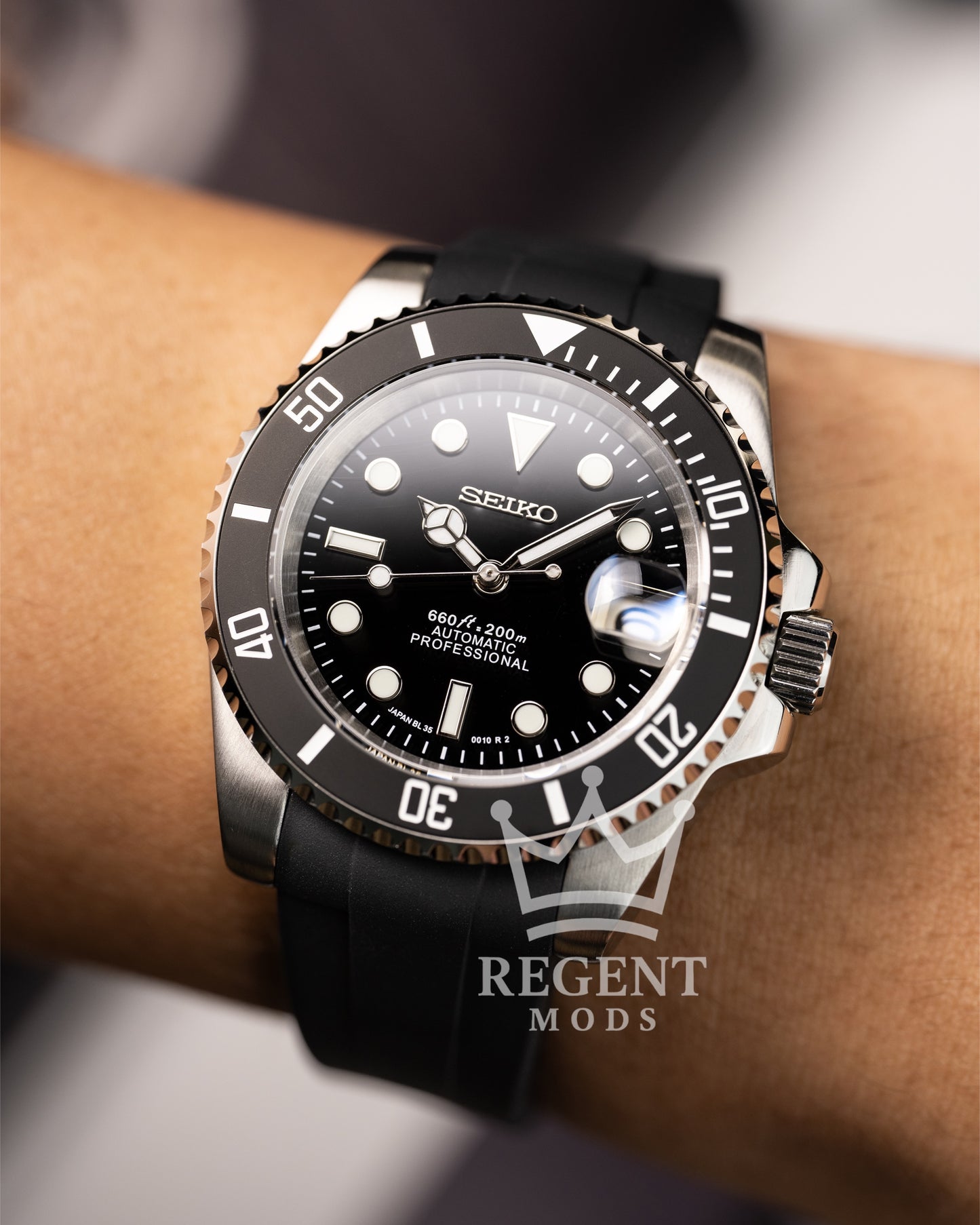 Black Seiko Mod Submariner Worn On Wrist With Rubber Strap