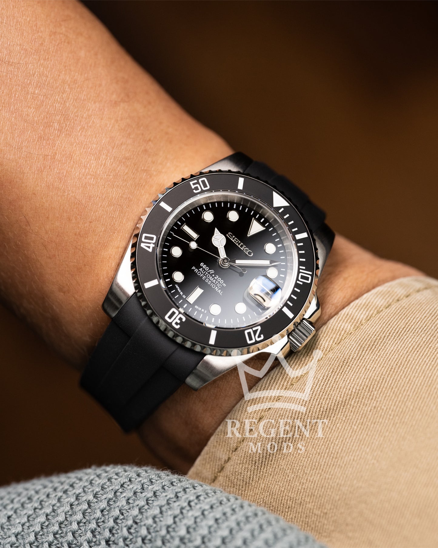 Black Seiko Mod Submariner Worn On Wrist With Rubber Strap