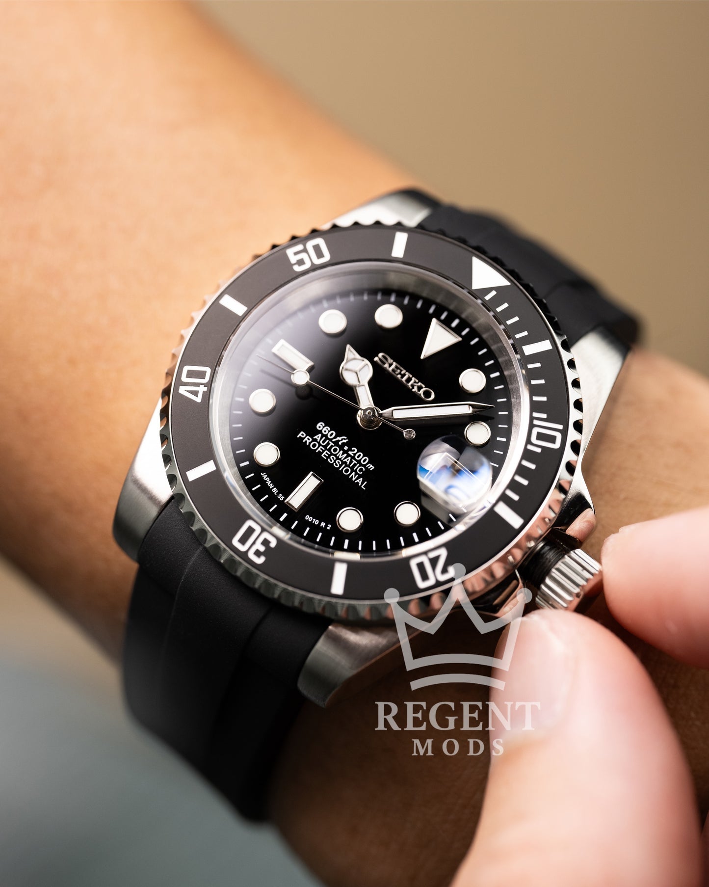 Black Seiko Mod Submariner Worn On Wrist With Rubber Strap