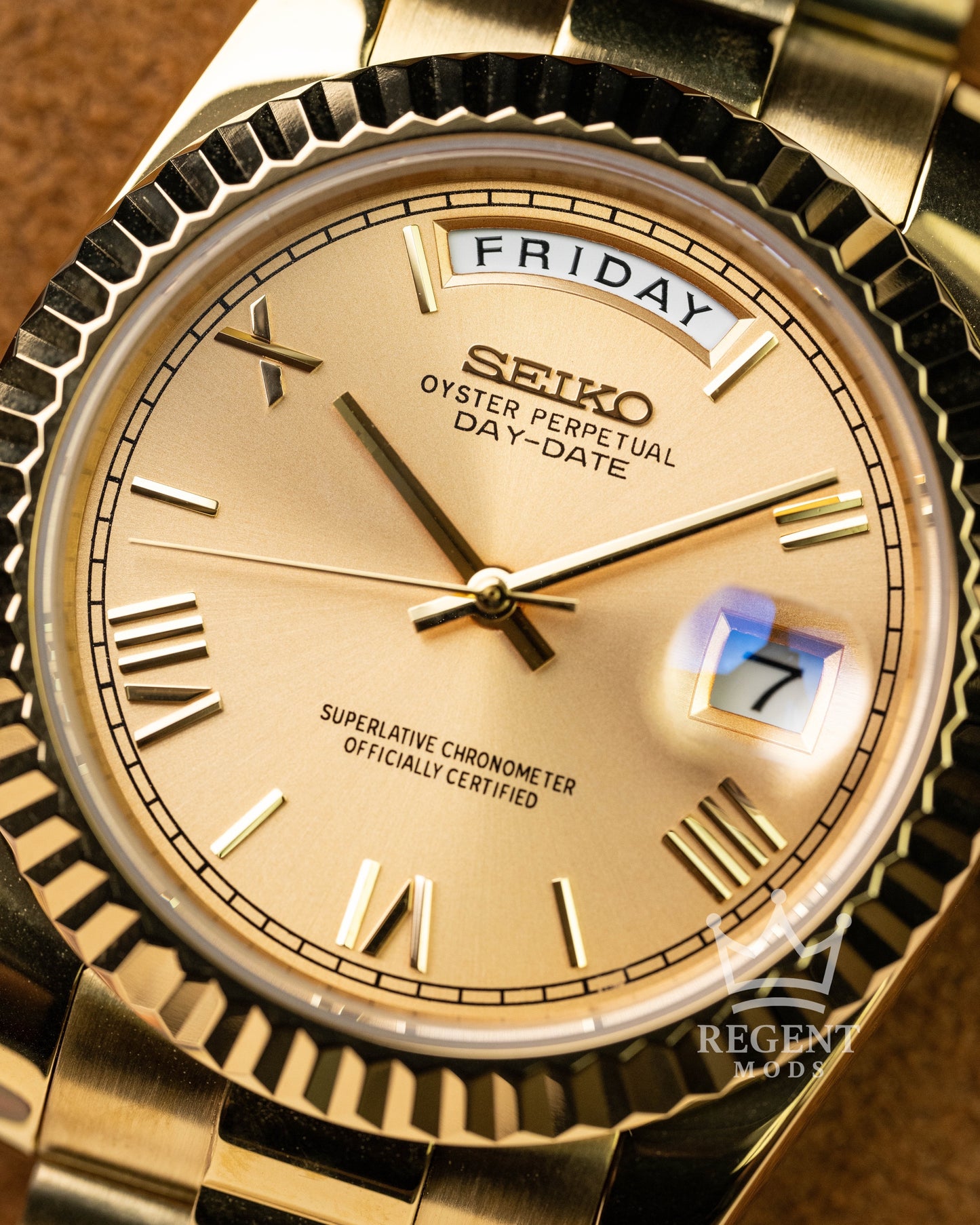 Custom Full Gold Seiko Day-Date Mod Featuring Champagne Dial Roman Numeral Markers Fluted Bezel And Classic President Bracelet