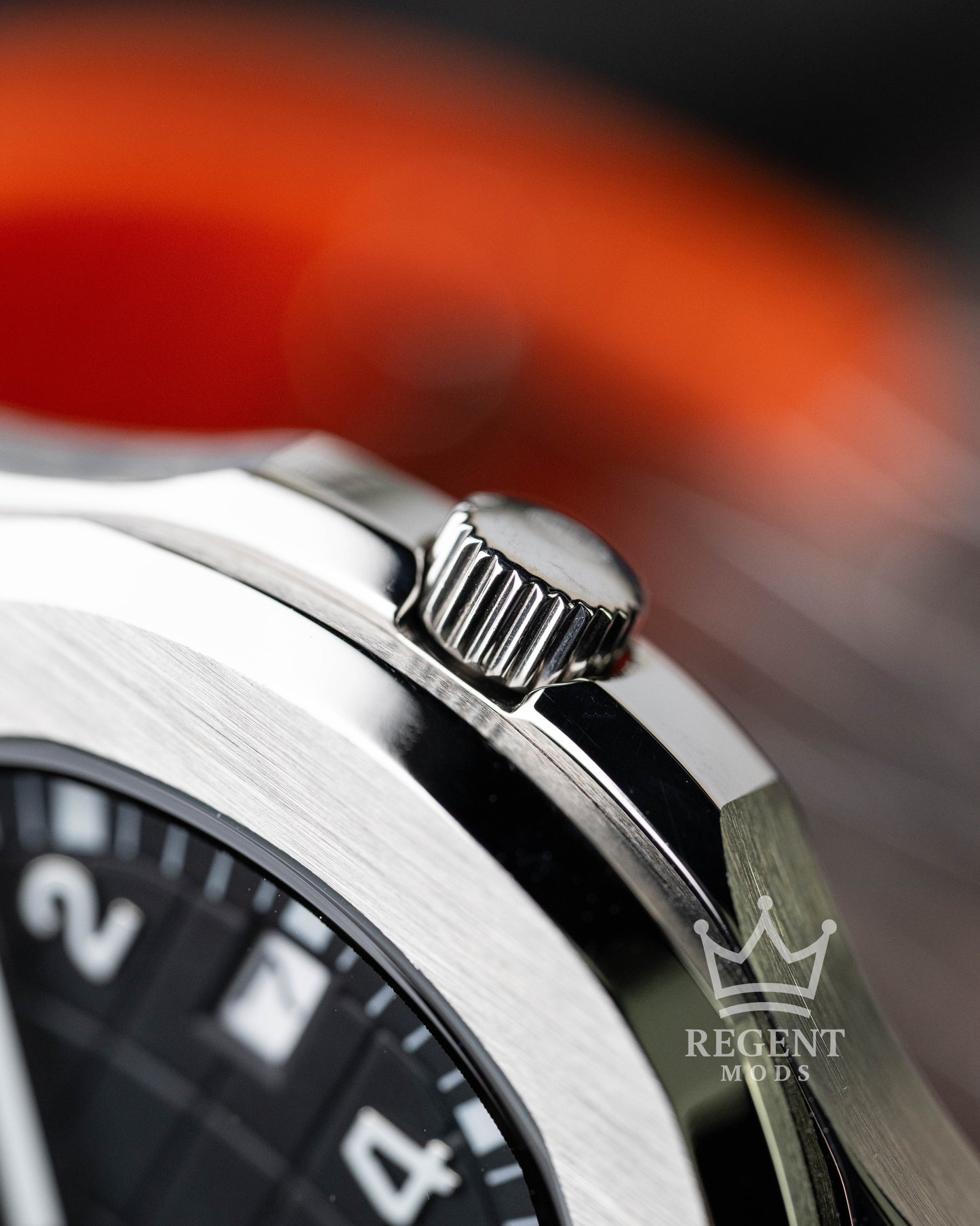 Custom Seiko Mod Aquanaut Nautilus With Black Dial Orange Seconds Hand Waffle Textured Face And Brushed Steel Bezel On Orange Rubber Strap