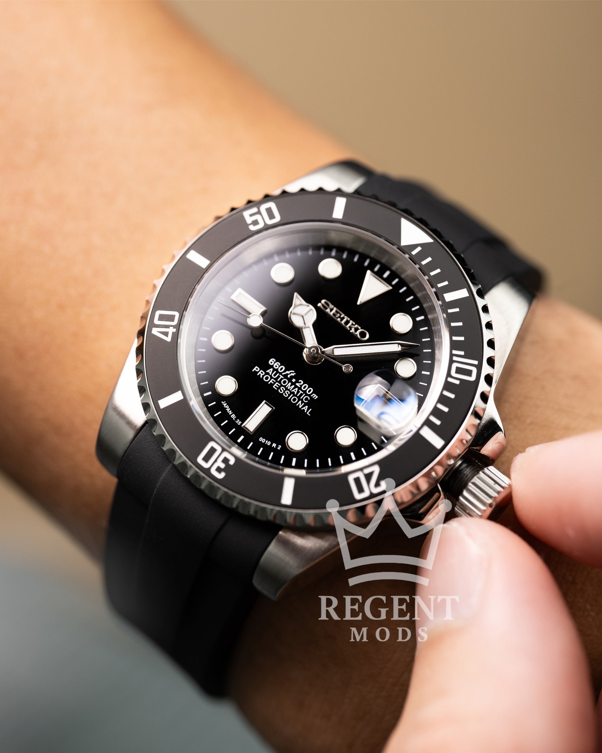 Black Seiko Mod Submariner Worn On Wrist With Rubber Strap